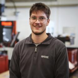 Portrait of Scott Dell in the mechanical workshop at the Cavendish Laboratory. 