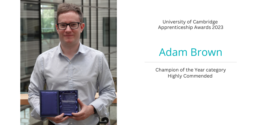 Portrait of Adam Brown holding his award