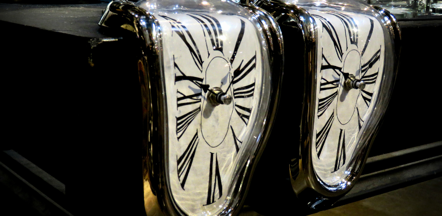Photo of two melting clocks in the style of Salvator Dali's 'The Persistence of Memory' painting