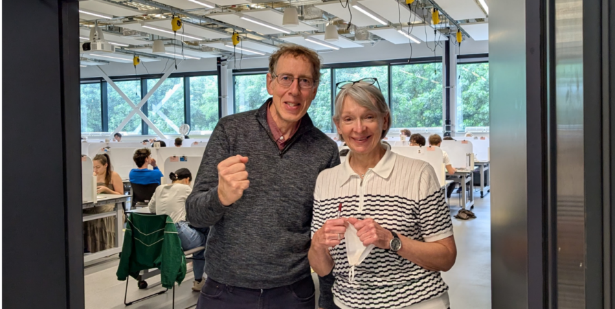 Richard King and Helen Marshall are in the Undergraduate Labs. In the background, exams are in progress.